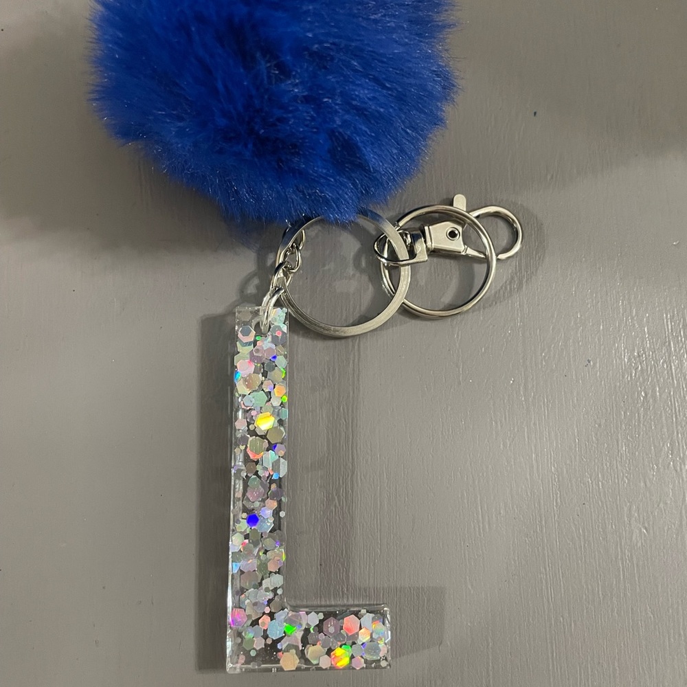 Letter L keychain with royal blue puff ball